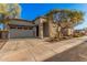 Well-maintained single-story home featuring desert landscaping, and a spacious driveway leading to a two-car garage at 21255 W Ashland Ave, Buckeye, AZ 85396
