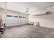 Spacious two car garage with overhead storage and garage door at 21255 W Ashland Ave, Buckeye, AZ 85396