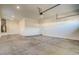 Clean and spacious two-car garage with ample room for vehicles and storage, featuring a clean concrete floor at 21255 W Ashland Ave, Buckeye, AZ 85396