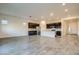 Open-concept living space with modern kitchen, large island, and ample room for entertaining and relaxing at 21255 W Ashland Ave, Buckeye, AZ 85396