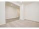Living room with adjacent rooms on wood look flooring at 21255 W Ashland Ave, Buckeye, AZ 85396