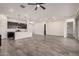 Spacious living room with an open-concept design, seamlessly connecting to a modern kitchen with ample countertop space at 21255 W Ashland Ave, Buckeye, AZ 85396
