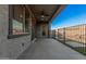 Covered patio with ceiling fan, glass sliding door, and view of the backyard at 21255 W Ashland Ave, Buckeye, AZ 85396