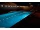 Backyard pool featuring modern lounge chairs and decorative string lights creating a relaxing and inviting space at 21255 W Ashland Ave, Buckeye, AZ 85396