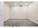 Neutral room with carpet, globe pendant lighting and light walls at 21255 W Ashland Ave, Buckeye, AZ 85396