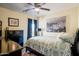 Inviting bedroom with soft lighting, modern furniture, and a picturesque artwork piece at 2315 E Pecan Rd, Phoenix, AZ 85040
