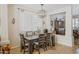 Dining room featuring a modern chandelier, a view to the living room, and stylish decor at 2315 E Pecan Rd, Phoenix, AZ 85040