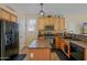 Well-equipped kitchen with stainless steel appliances, granite countertops, and ample cabinet space at 2315 E Pecan Rd, Phoenix, AZ 85040