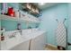 Functional laundry room with ample storage, a utility sink, and modern washing machines at 2315 E Pecan Rd, Phoenix, AZ 85040