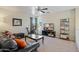 Relaxing living room with a ceiling fan, a TV, comfortable sofa, and exercise equipment at 2315 E Pecan Rd, Phoenix, AZ 85040