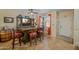 Cozy living room featuring a custom bar, tile flooring, and ample natural light at 2315 E Pecan Rd, Phoenix, AZ 85040