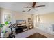 Upstairs living room with a ceiling fan, a TV, houseplants, and modern furnishings at 2315 E Pecan Rd, Phoenix, AZ 85040