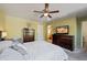 Bright and airy main bedroom with a ceiling fan, dresser, and comfortable decor at 2315 E Pecan Rd, Phoenix, AZ 85040