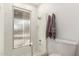 A full bathroom with glass enclosed shower and purple towel at 2407 W Paradise Ln, Phoenix, AZ 85023