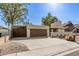 Single-story home with two-car garage and extended driveway at 2407 W Paradise Ln, Phoenix, AZ 85023