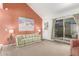 Living room with a vaulted ceiling and sliding doors at 2407 W Paradise Ln, Phoenix, AZ 85023