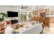 Living room with tile floors, view to eat-in kitchen, and backyard access at 2407 W Paradise Ln, Phoenix, AZ 85023