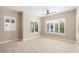 Bright and airy bedroom with shuttered windows and neutral walls at 26635 W Covey Ln, Buckeye, AZ 85396