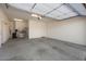Spacious garage with storage shelves and a clean, organized layout, ready for vehicles and projects at 26635 W Covey Ln, Buckeye, AZ 85396