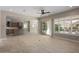 Spacious open layout connecting the living room with the gourmet kitchen and access to outdoor patio at 26635 W Covey Ln, Buckeye, AZ 85396