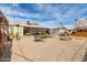 Backyard with a fire pit, outdoor furniture, and a clothesline on a sunny day at 2925 W Highland Ave, Phoenix, AZ 85017
