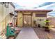 Backyard featuring a walkway leading to a charming outbuilding with double doors at 2925 W Highland Ave, Phoenix, AZ 85017