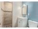 Bathroom featuring a tiled shower and a modern vanity at 2925 W Highland Ave, Phoenix, AZ 85017