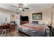 Comfortable bedroom with a ceiling fan, closet space, and artwork at 2925 W Highland Ave, Phoenix, AZ 85017