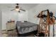 Cozy bedroom features stylish flooring and a wood ladder with hats and bags at 2925 W Highland Ave, Phoenix, AZ 85017