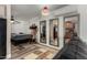 Bright bedroom featuring stylish tile floors and multiple mirrors reflecting the kitchen at 2925 W Highland Ave, Phoenix, AZ 85017