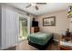 Bedroom featuring a sliding glass door, ceiling fan, and natural light at 2925 W Highland Ave, Phoenix, AZ 85017