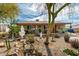 Charming single-story home featuring a well-maintained front yard with mature landscaping at 2925 W Highland Ave, Phoenix, AZ 85017