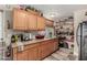 Kitchen featuring wooden cabinets, granite countertops, and plenty of storage space at 2925 W Highland Ave, Phoenix, AZ 85017