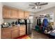 Functional kitchen with wooden cabinetry, stainless steel refrigerator, and ceiling fan at 2925 W Highland Ave, Phoenix, AZ 85017