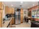 Functional kitchen with stainless steel appliances, ample cabinet space, and tiled floors at 2925 W Highland Ave, Phoenix, AZ 85017