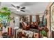 Inviting living room with a ceiling fan, comfortable seating, and ample natural light at 2925 W Highland Ave, Phoenix, AZ 85017