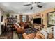 Inviting living room with comfortable leather seating, wooden accents, and neutral colors at 2925 W Highland Ave, Phoenix, AZ 85017