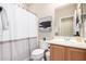 Bathroom with a tub-shower combo, single sink vanity, and updated fixtures at 2951 W Plum Hollow Dr, Anthem, AZ 85086