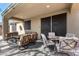Comfortable covered patio with ample seating, ideal for outdoor relaxation and enjoying the Arizona weather at 2951 W Plum Hollow Dr, Anthem, AZ 85086