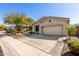Well-maintained home with a paved driveway, desert landscaping, and a two-car garage at 2951 W Plum Hollow Dr, Anthem, AZ 85086