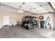 Spacious garage with room for a golf cart and storage, offering practical functionality at 2951 W Plum Hollow Dr, Anthem, AZ 85086