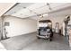 Clean and organized garage space with a golf cart, providing ample storage and parking options at 2951 W Plum Hollow Dr, Anthem, AZ 85086