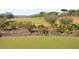 Picture of a well-manicured golf course surrounded by natural desert vegetation at 2951 W Plum Hollow Dr, Anthem, AZ 85086