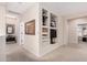Upstairs hallway with wall niches, a large mirror, and access to bedrooms at 2951 W Plum Hollow Dr, Anthem, AZ 85086