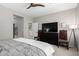 Spacious main bedroom featuring a ceiling fan, large dresser, and neutral walls at 2951 W Plum Hollow Dr, Anthem, AZ 85086