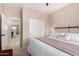 Bedroom showcasing a view to a secondary living space, closet, and an outside view at 2951 W Plum Hollow Dr, Anthem, AZ 85086