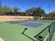 Multiple pickleball courts with green and blue surfaces, ready for a game in a scenic community at 2951 W Plum Hollow Dr, Anthem, AZ 85086