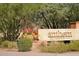 Close up of Anthem Golf & Country Club sign featuring colorful flowers nestled in desert landscaping at 2951 W Plum Hollow Dr, Anthem, AZ 85086