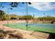 Elevated view of tennis courts at Anthem Golf & Country Club, featuring stadium seating & desert landscaping at 2951 W Plum Hollow Dr, Anthem, AZ 85086