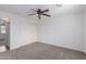 Bedroom has a closet with modern ceiling fan and neutral carpet at 3217 E Friess Dr, Phoenix, AZ 85032